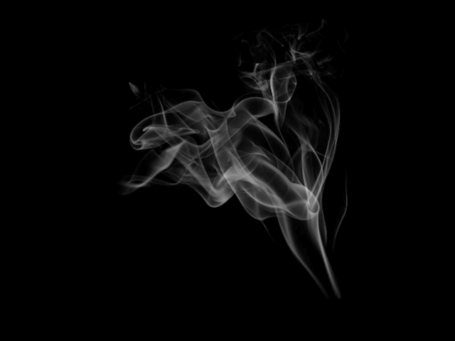 黒い背景と白い煙の写真